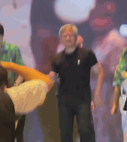 Blurry Man in Black Shirt With White Arrow