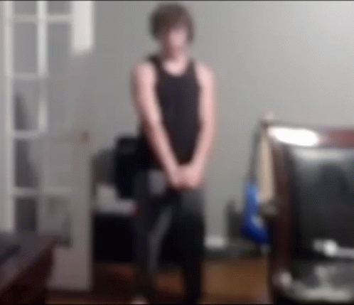 Blurry Man in Black Tank Top Standing