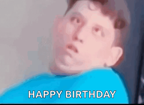 Blurry Man in Blue Shirt Saying Happy Birthday