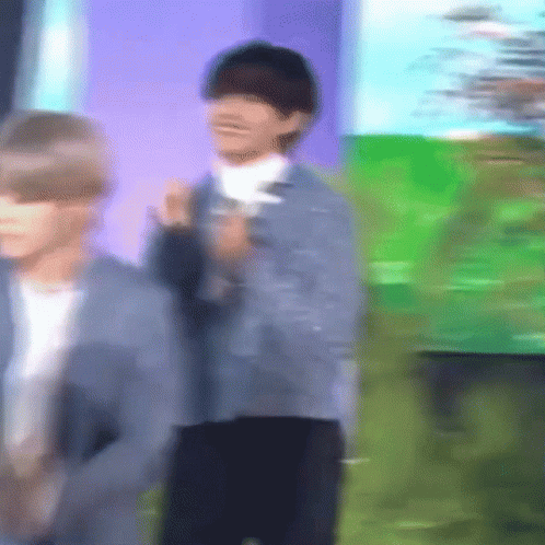 Blurry Man in Front of Green Field
