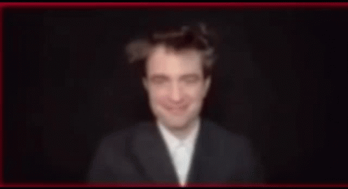 Blurry Man in Suit and Bow Tie Smiling