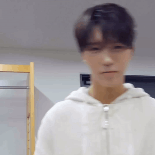 Blurry Man In White Hoodie GIF