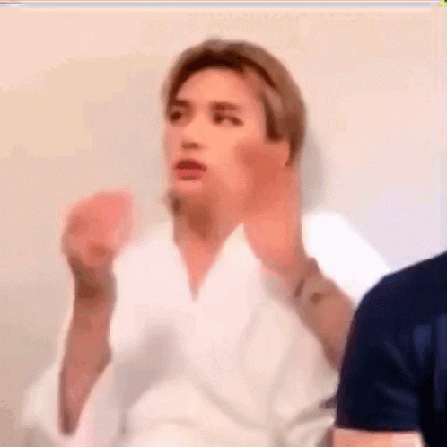 Blurry Man In White Robe Making Face GIF