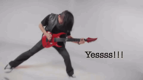Blurry Man Playing Red Electric Guitar Saying Yesss