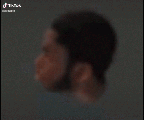 Blurry Man's Face With Tik Tok Watermark