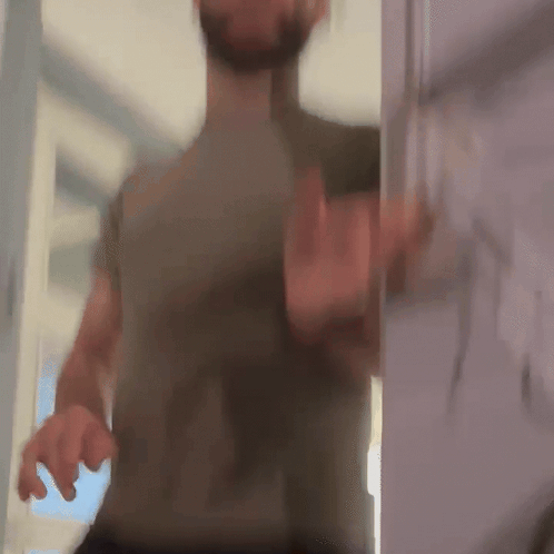 Blurry Man Standing In Doorway GIF