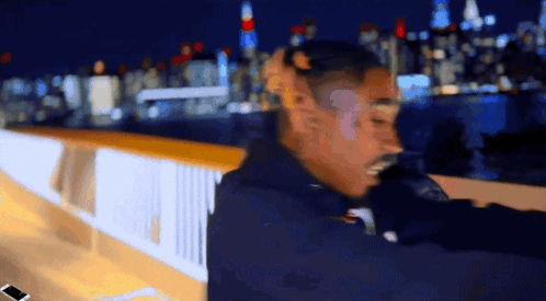 Blurry Man Standing On Bridge At Night GIF