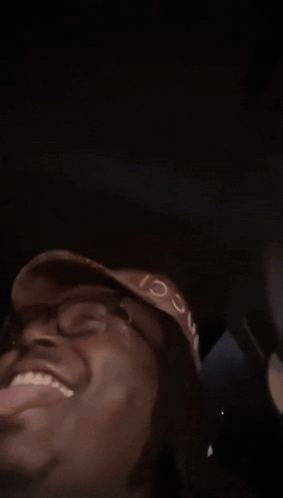 Blurry Man Wearing Hat And Glasses GIF
