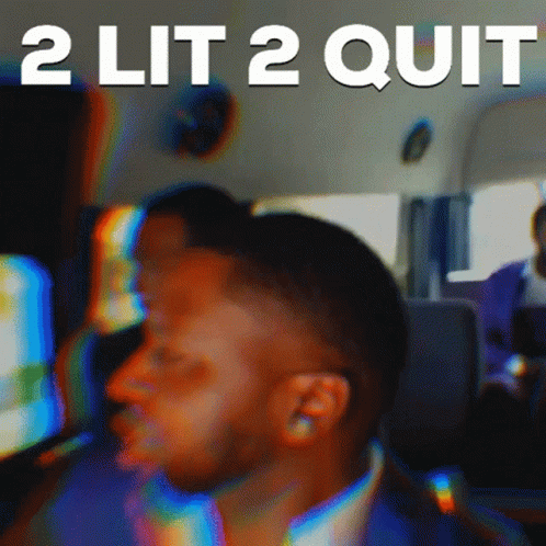 Blurry Man With 2 Lit 2 Quit Behind Him GIF