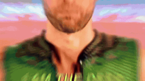 Blurry Man With Beard In Green Shirt Saying AA GIF