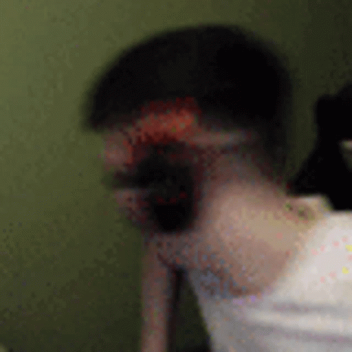 Blurry Man with Beard in White Shirt