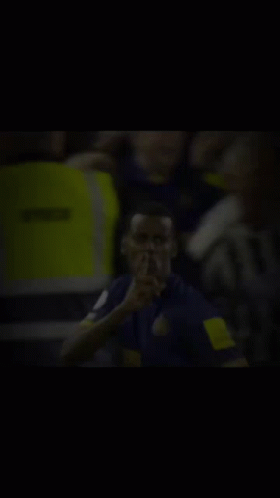 Blurry Man With Finger On Lips GIF
