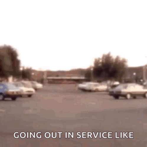 Blurry Parking Lot Sign Saying Going Out In Service Like GIF