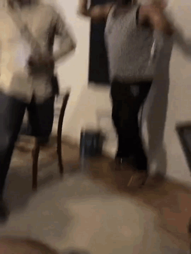 Blurry People Dancing in a Room