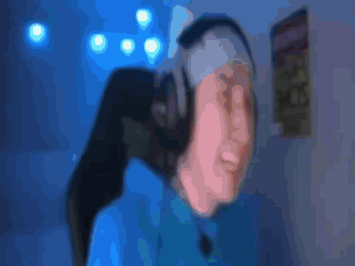 Blurry Person Covering Face With 3:00 Sign GIF