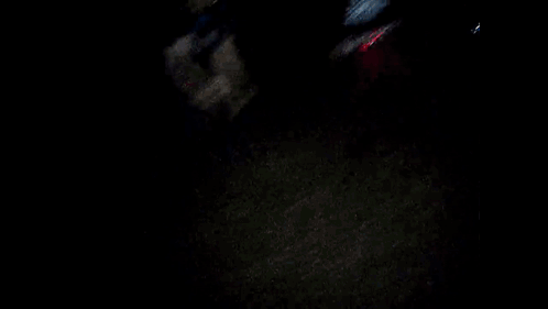 Blurry Person Holding Head In Dark Room GIF