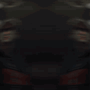 Blurry Person in Red and Blue Jacket