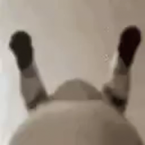 Blurry Person Lying Back Legs Up