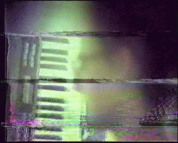 Blurry Person Playing Piano with Green Light