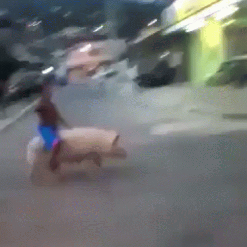 Blurry Person Riding Horse Down Street