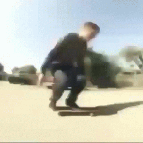 Blurry Person Riding Skateboard Down Street GIF