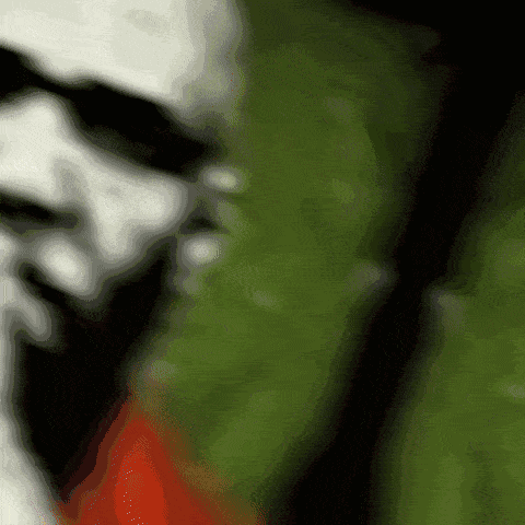 Blurry Person's Face Green And Red Background GIF