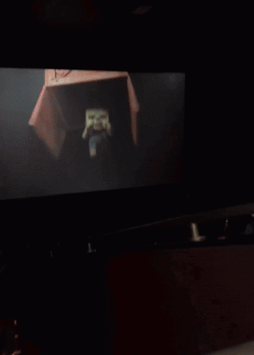 Blurry Person's Face With Yellow Light GIF