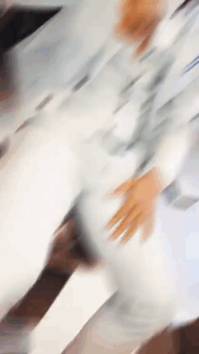 Blurry Person's Hands on Table