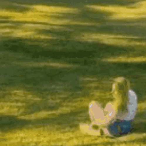 Blurry Person Sitting On Ground GIF