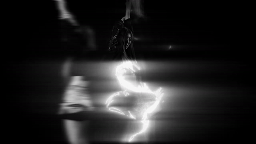 Blurry Person Standing by Glass Door