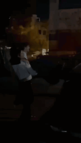 Blurry Person Standing in Dark