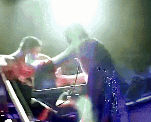 Blurry Person Standing on Stage