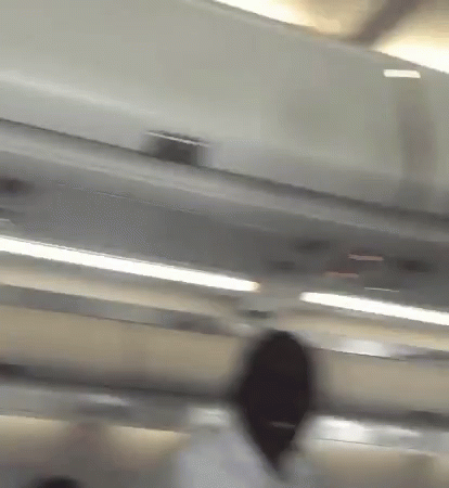 Blurry Person Standing Under Ceiling