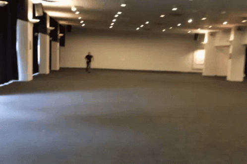 Blurry Person Walking in Large Room
