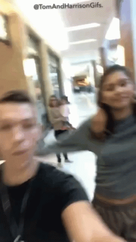 Blurry Photo Of Man And Woman Tom And Harrison GIF