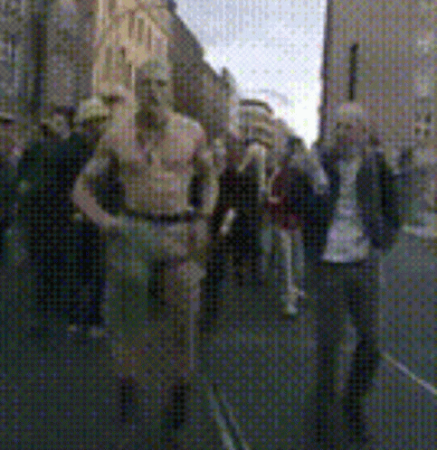 Blurry Photo of People Walking Down Street