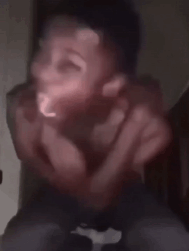 Blurry Picture of Shirtless Man Making Funny Face