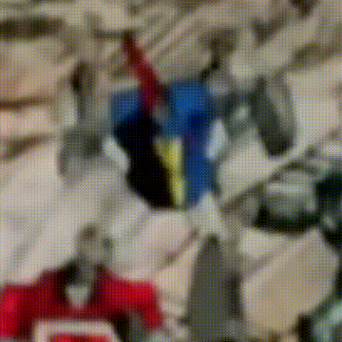 Blurry Robot With Red Blue And Yellow Stripe On Chest GIF