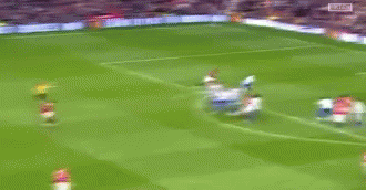 Blurry Soccer Game Players In Red GIF