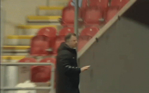 Blurry Soccer Player In Blue Jersey Celebrating GIF