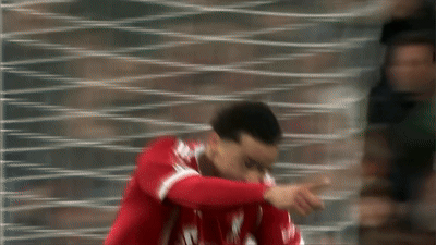 Blurry Soccer Player in Red Liverpool Jersey