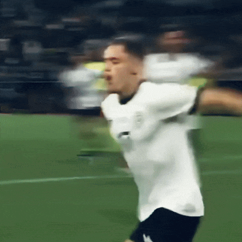 Blurry Soccer Player in White Shirt