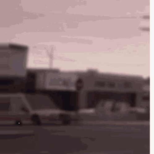 Blurry Street With Cars and Buildings