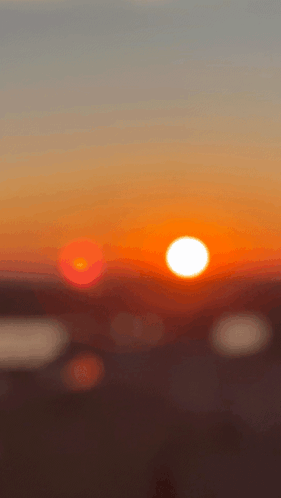 Blurry Sunset With Sun In Center GIF