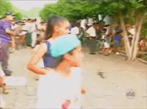 Blurry Woman Carrying Child on Back