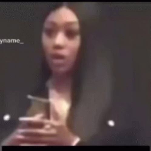Blurry Woman Holding Hands to Face