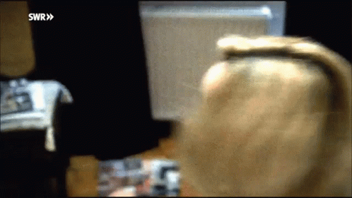 Blurry Woman Looking At Computer Screen SWR GIF
