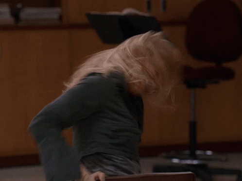 Blurry Woman Sitting In Office Chair GIF