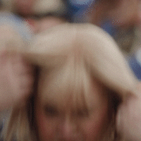 Blurry Woman With Man's Arm Behind Her