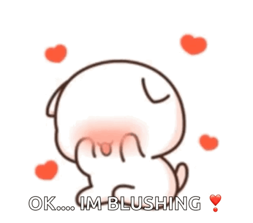 Blushing Cartoon Character With Hearts GIF